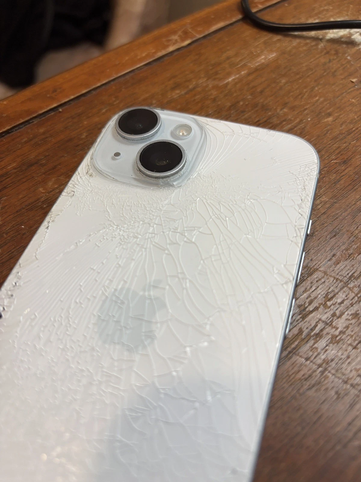 Apple iPhone 15  blue 128GB Unlocked   cracked back glass