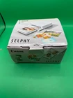 Canon SELPHY CP1500 Compact Photo Printer White  New   Packaging flawed