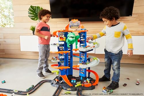 Hot Wheels Ultimate Garage Track Set with 2 Toy Cars  Hot Wheels City Playset with Multi Level Side by Side Racetrack  Moving T Rex Dino & Storage for 100  1 64 Scale Vehicles  Amazon Exclusive 