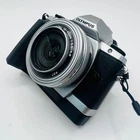 OLYMPUS Mirrorless Camera OM D E M10 with ED 14 42mm F3 5 5 6 EZ Lens Kit Silver