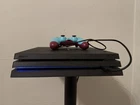 Sony PlayStation 4 Pro 1TB Console with Berry Blue Dualshock 4 Controller