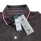 Polo Tommy Hilfiger de secado rápido con protección UV y ribete de rayas para hombre