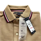 Polo Tommy Hilfiger de secado rápido con protección UV y ribete de rayas para hombre