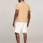 Polo Tommy Hilfiger de secado rápido con protección UV y ribete de rayas para hombre