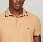 Polo Tommy Hilfiger de secado rápido con protección UV y ribete de rayas para hombre