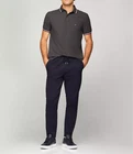 Polo Tommy Hilfiger de secado rápido con protección UV y ribete de rayas para hombre