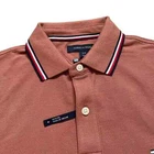 Polo Tommy Hilfiger de secado rápido con protección UV y ribete de rayas para hombre