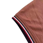 Polo Tommy Hilfiger de secado rápido con protección UV y ribete de rayas para hombre