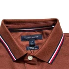 Polo Tommy Hilfiger de secado rápido con protección UV y ribete de rayas para hombre
