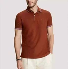 Polo Tommy Hilfiger de secado rápido con protección UV y ribete de rayas para hombre
