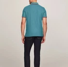 Polo Tommy Hilfiger de secado rápido con protección UV y ribete de rayas para hombre