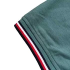 Polo Tommy Hilfiger de secado rápido con protección UV y ribete de rayas para hombre