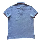 Polo Tommy Hilfiger de secado rápido con protección UV y ribete de rayas para hombre