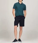 Polo Tommy Hilfiger de secado rápido con protección UV y ribete de rayas para hombre