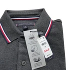 Polo Tommy Hilfiger de secado rápido con protección UV y ribete de rayas para hombre