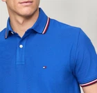 Polo Tommy Hilfiger de secado rápido con protección UV y ribete de rayas para hombre